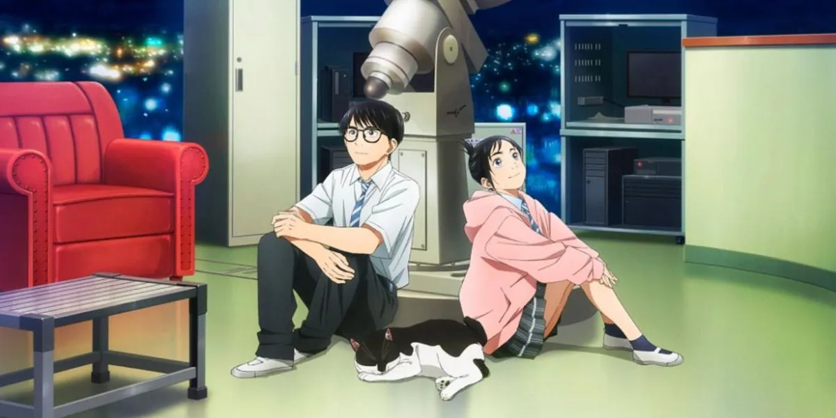 A boy in glasses and a girl in a pink cardigan sit on the floor of a school observatory beside a telescope and a cat, in a still from Insomniacs After School